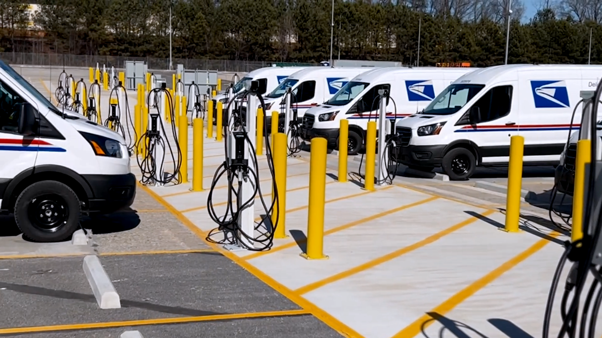 Check out the new electric postal vans and charging stations